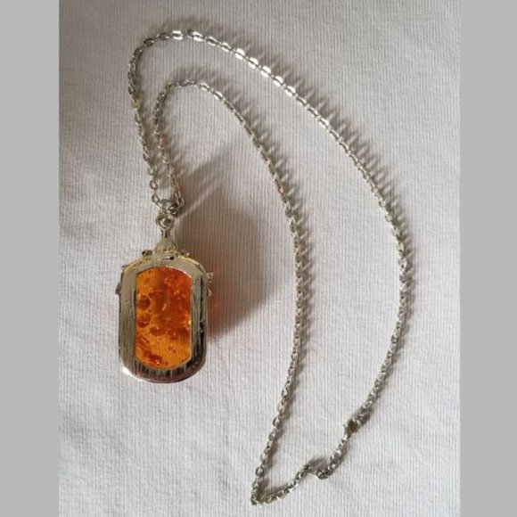Attractive, faux amber pendant on a silver colored chain. - Picture 3 of 4